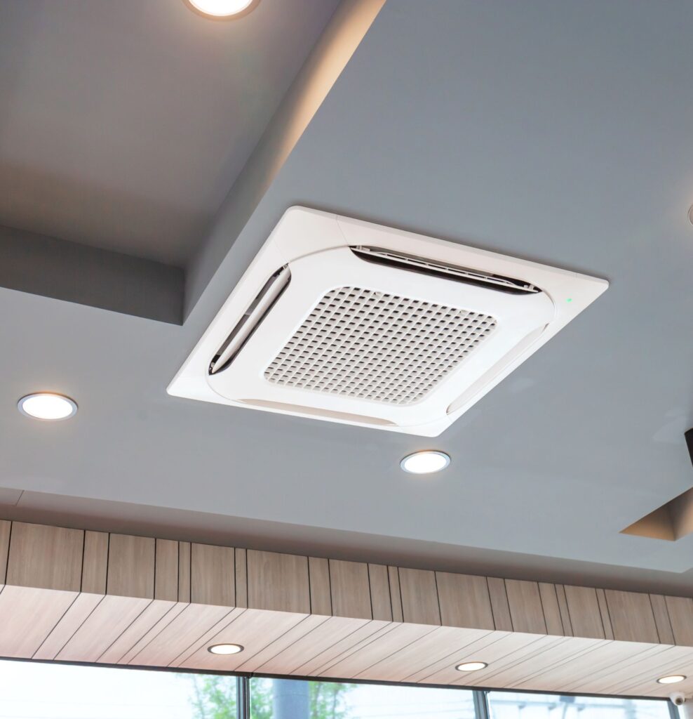 Ceiling cassette air conditioning unit in a commercial building.